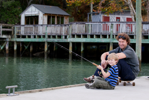 Pete Head and his son, Theo fish off the wharf. Photo / Sarah Ivey