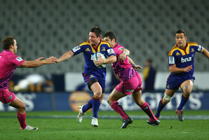 Mike Delany charges the Bulls defence. Photo / Getty Images