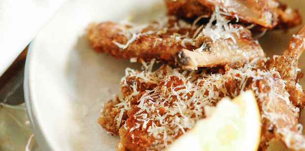Lemon wedges add tartness to crumbed cutlets. Photo / Jason Dorday