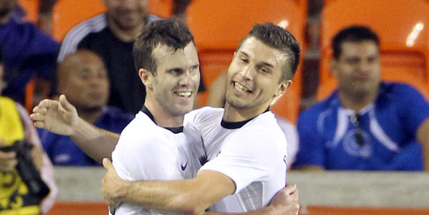 New Zeland's Ian Hogg, left, gets a hug from Kosta Barbarouses after he scored a goal during the first half of an international friendly soccer game against El Salvador. Photo / AP