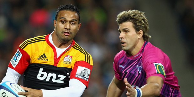Lelia Masaga of the Chiefs runs past Wynand Olivier of the Bulls during the round 14 Super Rugby match between the Chiefs and the Bulls at Waikato Stadium. Photo / Getty Images.