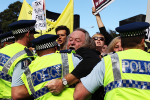 Protests erupted during John Key's post-Budget address. Photo / Getty Images