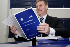 Finance Minister Bill English looking over copies of his 2012 Budget hot off the press at Printlink. Photo / Mark Mitchell