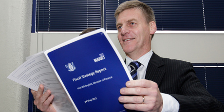 Finance Minister Bill English looking over copies of his 2012 Budget hot off the press in Parliament this morning. Photo / Mark Mitchell