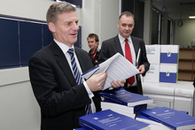 Bill English with copies of the 2012 Budget. Photo / Mark Mitchell Bill English with copies of the 2012 Budget. Photo / Mark Mitchell