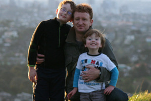 Martin Cocker says his phone has sometimes taken precedence to his boys Oliver (left) and Oscar. Photo / Supplied