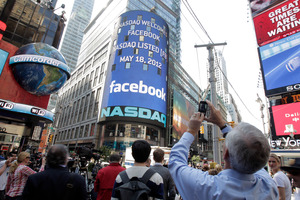 Nasdaq's giant monitor in Times Square shows a welcome message for Facebook. Photo / AP