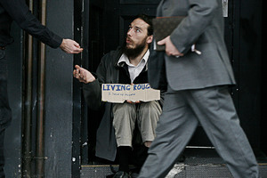 Will this week's Budget affect hand-outs on Queen St ? Photo / Chris Skelton