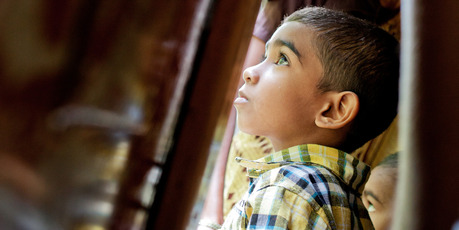 Locals ride the train through hills covered in tea plantations from Ella to Nanu-oya in Sri Lanka. Photo / Babiche Martens