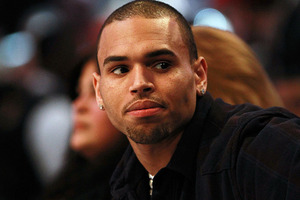 Chris Brown has told his fans to calm down after they lashed out at pop star Pink. Photo / Getty
