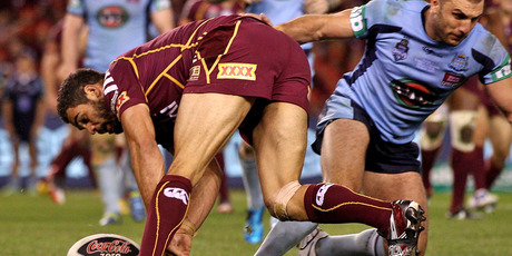 The ball is knocked out of Greg Inglis' hands during Origin I before he regathered to score. Photo / Getty Images