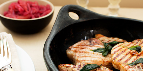 Stewed apples with red onions, grilled pork chops and sage butter. Photo / Babiche Martens