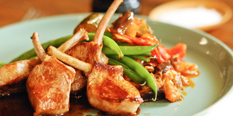 Lamb cutlets sit delicately on a serving of ratatouille. Photo / Jason Dorday