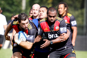 Stephen Donald and Sitiveni Sivivatu get tackled by Hikawera Elliot during Waikato Chiefs open training. Photo / Christine Cornege