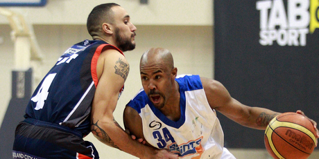 Jason Crowe of the Saints dribbles around Lindsay Tait of the Pirates during the NBL final between the Wellington Saints and the Auckland Pirates. Photo / Getty Images.