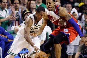 Boston Celtics guard Rajon Rondo drives against Philadelphia 76ers forward Andre Iguodala, right, during the fourth quarter of Game 7. Photo / AP