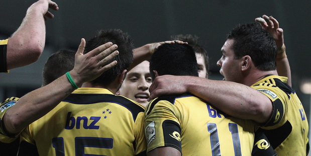 Julian Savea of the Hurricanes is congratulated by his team mates after scoring a try during the round 15 Super Rugby match between the Waratahs and the Hurricanes. Photo / Getty Images.