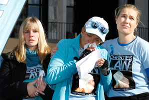 Tracey Marceau, centre, her daughter Heather, holding Christies ashes, and Christie Law chairwoman Ruth Money. Photo / Mark Mitchell