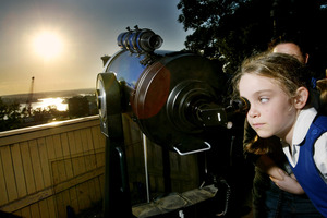 Students in Sydney look through a telescope to watch the transit of Venus. Photo / AP