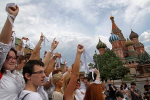 Opposition supporters wearing white ribbons as a symbol of the protest movement against Russian President Vladimir Putin rally at Red Square in front of the St. Basil's Cathedral in Moscow, Russia. Photo / AP