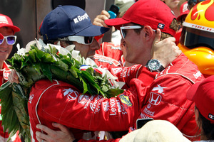 Dario Franchitti, left, of Scotland, is congratulated by Scott Dixon, of New Zealand. Photo / AP