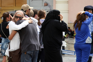 Family members of victims react with grief after the fire took hold of the Villagio Mall. Photo / AP