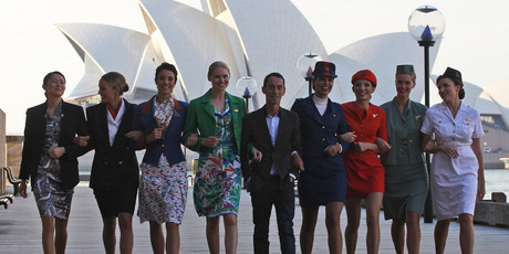 Australian designer Martin Grant, centre, walks with models wearing the Qantas uniforms old to the current.
Photo / AP