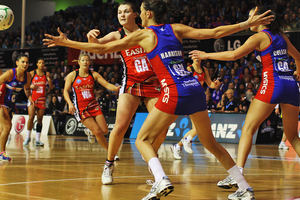Anna Harrison of the Mystics defends against Ellen Halpenny of the Tactix. Photo / Getty Images