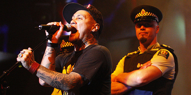 Tiki Taane performs with dancers dressed as police during last year's New Zealand Music Awards. Photo / Richard Robinson