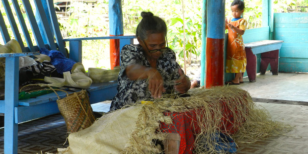 Taumuli Salu keeps alive the Samoan tradition of fine-mat weaving in her village of Palauli Photo / Dan Ahwa
