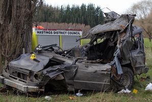 Four people died when this vehicle left a Hawke's Bay road, hit a poplar tree and landed in a paddock, 2km up Waikare Rd, Putorino. Photo / Duncan Brown