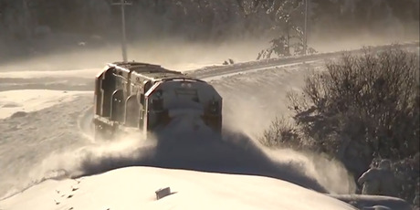 KiwiRail attempts to plough a route through heavy snow in Arthurs Pass, which links Christchurch and the West Coast. Picture / Geoff Mackley.