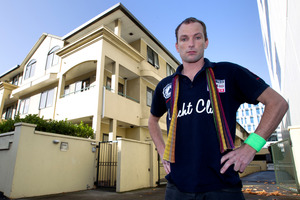 Ryan Pausina stands outside the apartments he claims need only minor repairs. Photo / Steven McNicholl