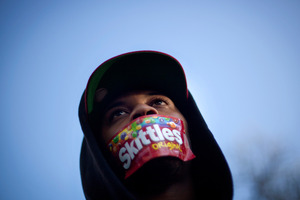 File photo from a rally held in Trayvon Martin's memory. Misdirected anger toward a man who was assigned Martin's accused killer's phone number has forced him to move. Photo / AP