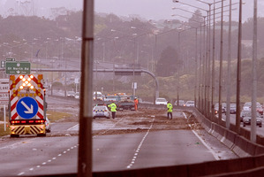 Debris from flooding covered the North Western Motorway after a similar day of heavy wind and rain in 2011. Photo / Dean Purcell
