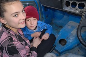 Ashleigh Gill, 12, and her brother Tyler Scadden, 6, near the hole in which a cat became trapped sometime overnight on Sunday. Photo / Nathan Crombie