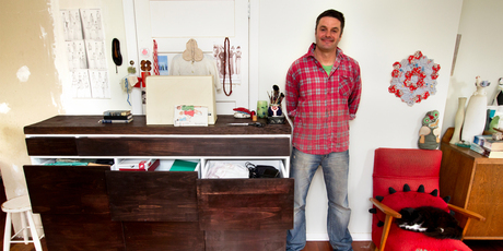 Justin Newcombe with his finished craft desk. Photo / Steven McNicholl