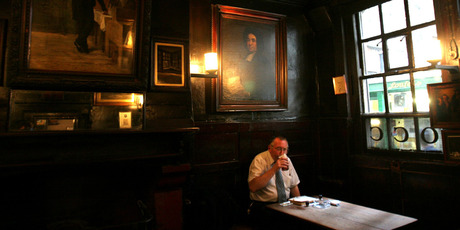 A patron sips his beer in the Ground Bar of Ye Olde Cheshire Cheese at 145 Fleet St. The Victorian London of Charles Dickens can still be seen, touched and smelled in places such as this. Photo / Bloomberg News