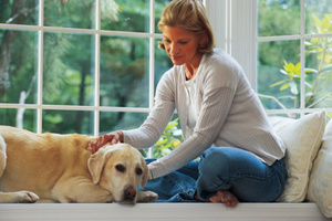 Woman at home with dog