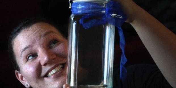 You can't see it, but Caraline Abbott (pictured) is sure there's a ghost in there.