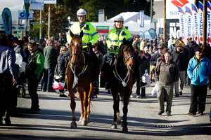 Police officers Bill and Karen Eivers are on horseback during the Fieldays at Mystery Creek. Photo / Christine Cornege