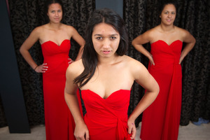 Mount Albert Grammar students Idoho Purcell, 17, Negin Shademan, 17, and Ashleigh Curtis, 18, try on ball dresses at Affordaball Dresses in Mt Roskill. The store keeps a register to avoid duplicating dresses at a school ball. Photo / Greg Bowker
