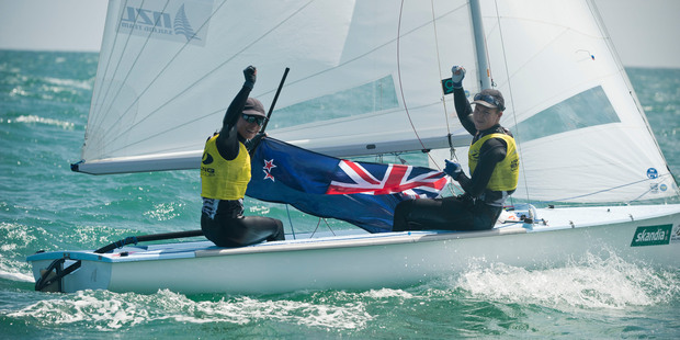 Jo Aleh and Olivia Powrie celebrate retaining their crown in the 470 event at Weymouth last week. Photo / Supplied.