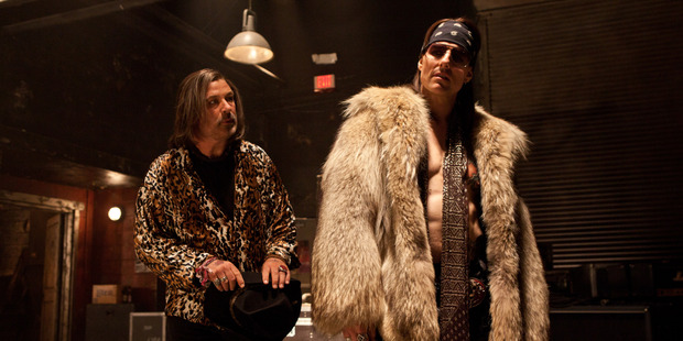 Tom Cruise shines as hair metal god, Stacee Jaxx, here with Alec Baldwin (left) as club owner, Dennis. Photo / Supplied