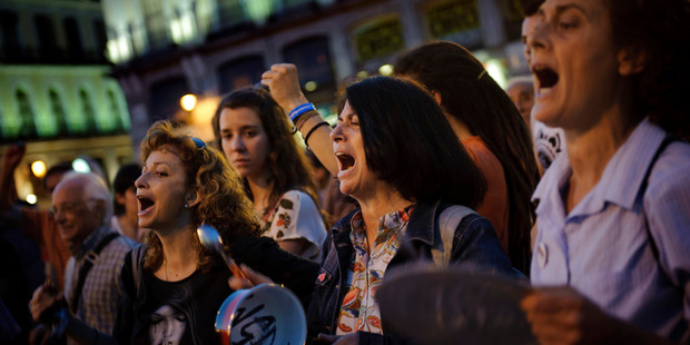 A protest against the financial crisis and the latest government measures in Madrid. European uncertainty should keep NZ's Reserve Bank in 'wait and see' mode this week. Photo / AP