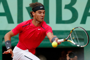 Spain's Rafael Nadal on his way to victory against Serbia's Novak Djokovic. Photo / AP