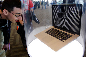 An attendee looks at the new MacBook Pro on display at the Apple Developers Conference in San Francisco. Photo / AP