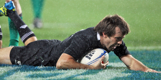 Conrad Smith dives over for his third career try against Ireland. Photo / Getty Images