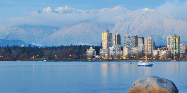 Vancouver's Grouse Mountain is seen in the background, beyond the city centre. Photo / Thinkstock