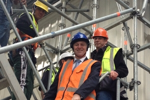 Prime Minister John Key at Old St Paul's Cathedral in Wellington inspects the work of young workers employed using a Government subsidy scheme after announcing a new scheme. Photo / Claire Trevett